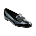 The Albert slipper in black patent calf with a silk bow.