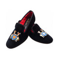 The Albert slipper in black velvet, a coat of arms embroidered on the vamp: a blue shield with a golden sun, two supporters and crested helms above.